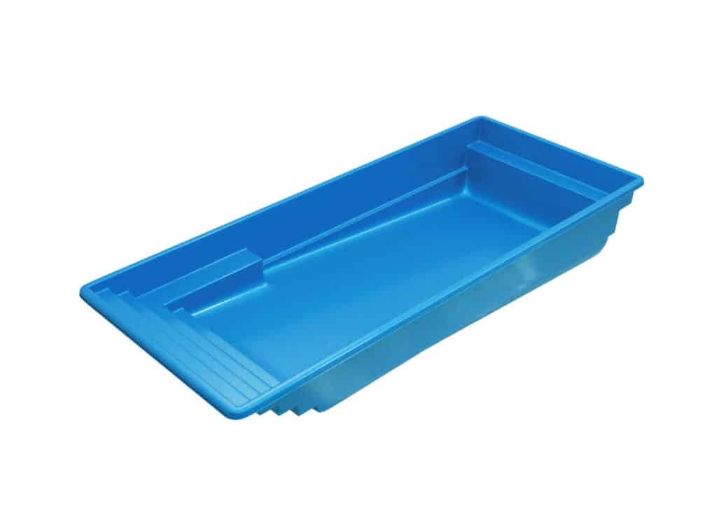 A blue plastic paint tray with ridges on one side, designed for holding paint while working on projects.